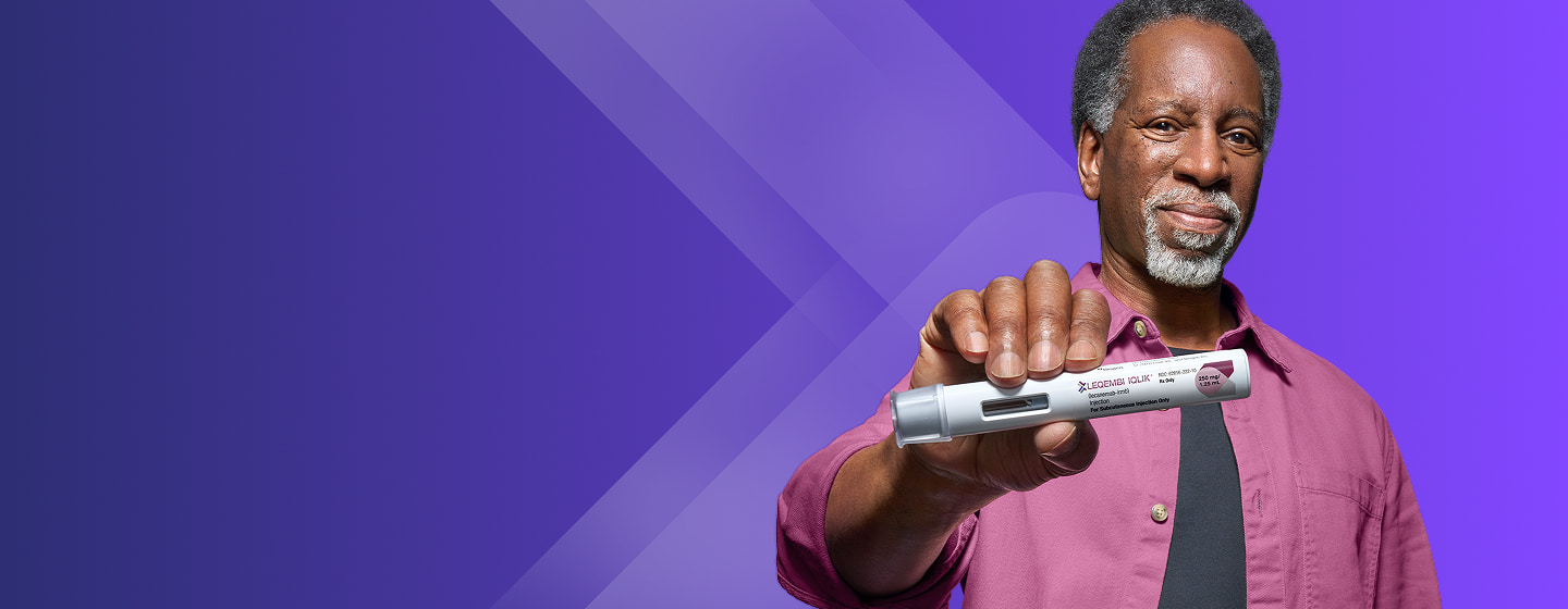 LEQEMBI® patient holding the IQLIK® autoinjector